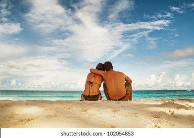 Honey moon couple on beautiful tropical vacation in the warm sunny Seychelles island oceans and palm trees