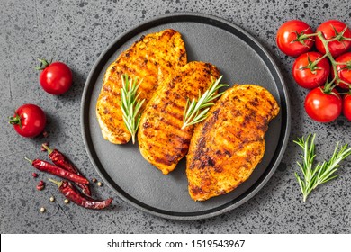 Honey Mustard Grilled Chicken Breasts, Cast Iron Skillet, Dark Background. Top View.