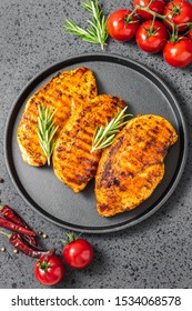 Honey Mustard Grilled Chicken Breasts, Cast Iron Skillet, Dark Background. Top View.