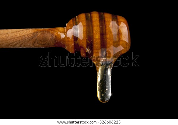 Honey On Black Background Stock Photo (Edit Now) 326606225