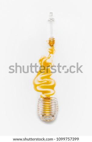 Image, Stock Photo Honey poured from glass with honey spoon