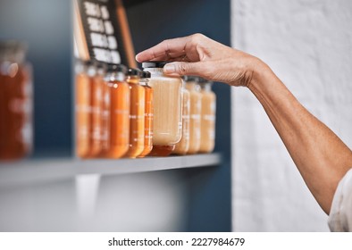 Honey, product and retail with hands of woman for natural, supermarket and grocery shopping shelf. Food, health and sustainability with organic store employee for small business, sale and choice - Powered by Shutterstock