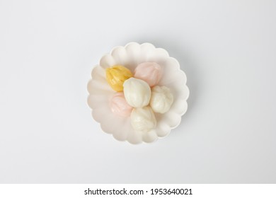 honey rice cake in a dish isolated on white background