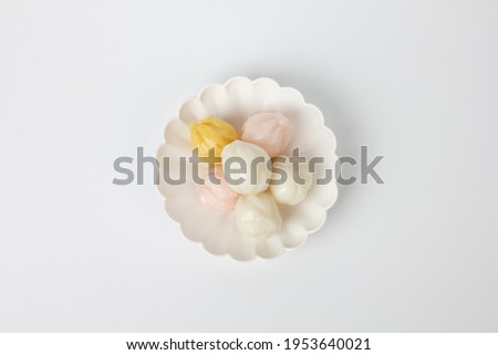 honey rice cake in a dish isolated on white background