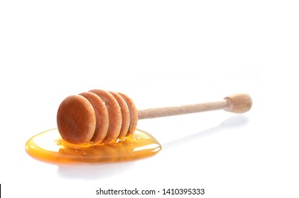 Honey Spoon With Yellow Liquid Honey Isolated On White