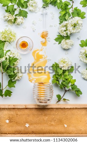 Image, Stock Photo Honey flows from glass and flowers