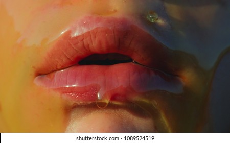 Honey. Sweet, sexy lips, temptation concept. Sweet taste on the female body, face mouth closeup. Lips in honey. Sweet kiss. Young girl and sugar concept. Food art. Beauty natural cosmetics, spa