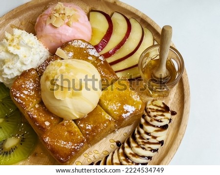 Similar – Image, Stock Photo Assorted gourmet pastries with fresh fruit toppings