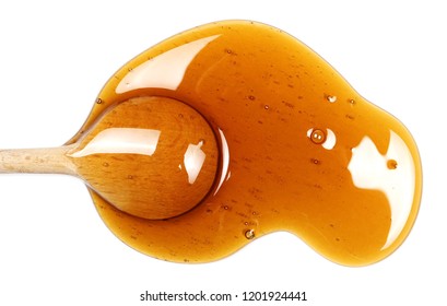 Honey and wooden spoon isolated on white background, top view
