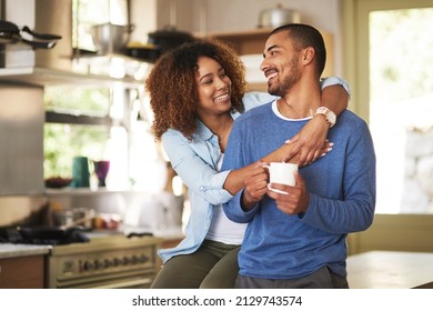 Honey, Youre The Best. Shot Of A Happy Young Couple Feeling Relaxed In The At Home.