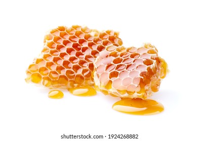 Honeycomb with honey drop on white background - Shutterstock ID 1924268882