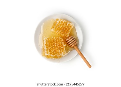 Honeycomb With Honey On A White Plate With Honey Dipper Isolated On White Background. Top View.