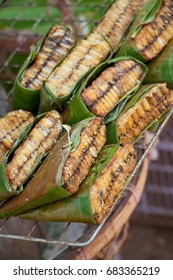Honeycomb wrapped with banana leaves, thai food culture - Shutterstock ID 683365219
