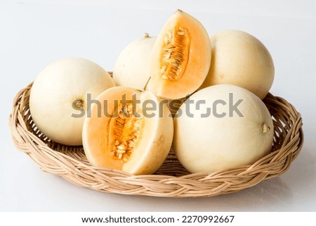 Honeydew Melons, Honey Melons, or Cantaloupe in Rattan Basket at shop and supermarket.