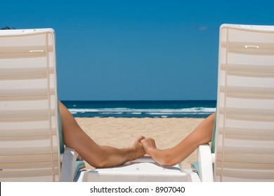 Honeymoon Couple in beach chairs on resort