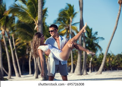 Honeymoon Couple On White Sandy Beach In Punta Cana, Dominican Republic