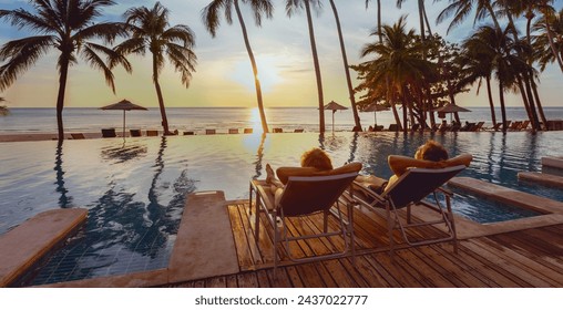 honeymoon couple relaxing near beach swimming pool in luxurious hotel, banner background, vacation travel - Powered by Shutterstock