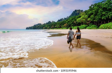 Honeymoon Couple Take A Walk At The Scenic Havelock Islands Beach At Andaman India.