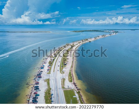 Honeymoon Island Beach. Dunedin Causeway. Summer vacation. Florida USA. Blue-turquoise color of salt water. Ocean or Gulf of Mexico. Summer vacations. Aerial view.