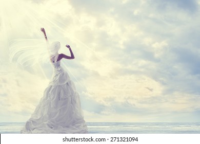 Honeymoon Trip, Bride in Wedding Dress over Blue Sky, Romantic Travel Concept, Looking Ahead