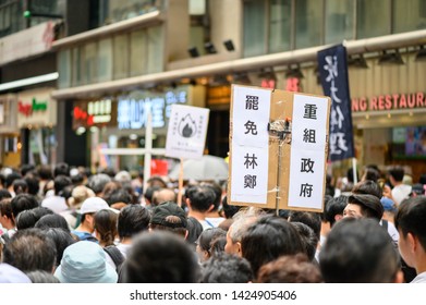 Hong Kong - 09 JUN 2019: 1.03 Million Citizen Are Protesting Against China Extradition Law. Chinese Translation: Carrie Lam, Step Down. Reorganize Government. 