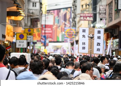 Hong Kong - 09 JUN 2019: 1.03 Million Citizen Are Protesting Against China Extradition Law. Chinese Translation: Carrie Lam, Step Down. Reorganize Government. 