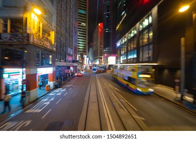 Hong Kong - 09/16/2019 : Blur background of tram or bus view at night. Crowd of people on street of Central district. Transportation for tourists with urban city in travel trip or holiday in downtown. - Shutterstock ID 1504892651