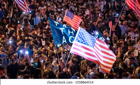 Hong Kong 14 Oct 2019: Hong Kong protesters fill Chater Garden, wave American flags and spill onto nearby roads in Central, calling for United States to pass Hong Kong Human Rights and Democracy Act