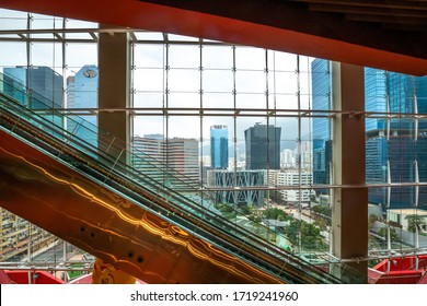 Hong Kong - 2020: Empty Escalator In MegaBox Mall, View From Window To The Park And Office Buildings.