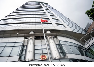 Hong Kong - 8 July 2020: A Chinese National Emblem And Flag Are Seen Outside The Office For Safeguarding National Security Of The Central People's Government In The Hong Kong.