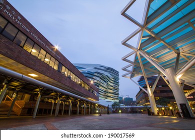 HONG KONG - APR 30, 2014: Night View Of The Jockey Club Innovation Tower. It Is Home To Hong Kong Polytechnic University's School Of Design. Designed By Pritzker-prize-winning Architect Zaha Hadid 