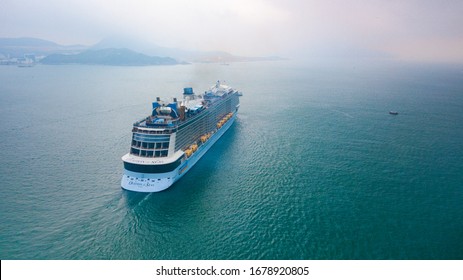 HONG KONG, HONG KONG - April 21 2018: Aerial view of Cruise Ship "Ovation of the Seas" owned by Royal Caribbean International cruising across the Lei Yue Mun Channel in Hong Kong. Editorial Use Only.
