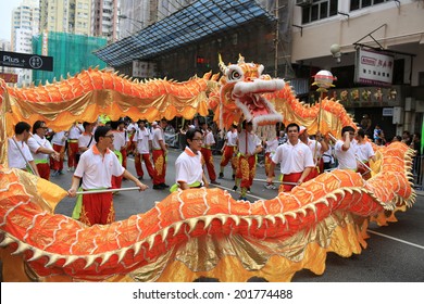 HONG KONG, APRIL 22: People dance the dragon in the Tin Hau birthday in Yuen Long on 22 april 2014. Tin Hau, Goddess of Sea in china. Locals rally dedicated to her for safety during the coming year.