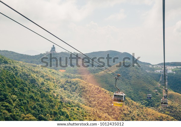 Hong\
Kong, August 30, 2017. Ngong Ping 360 is a tourism project on\
Lantau Island in Hong Kong with Buddha on the horizon. The project\
was previously known as Tung Chung Cable Car\
Project