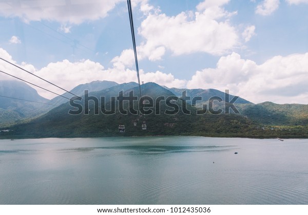 Hong\
Kong, August 30, 2017. Ngong Ping 360 is a tourism project on\
Lantau Island in Hong Kong with Buddha on the horizon. The project\
was previously known as Tung Chung Cable Car\
Project