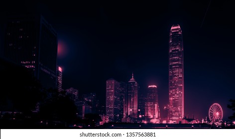 Hong Kong Business District at Night. Corporate building at the back and busy traffic across the main road at rush hour - Shutterstock ID 1357563881