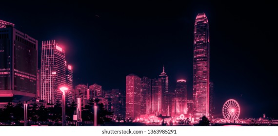 Hong Kong Business District at Night. Corporate building at the back and busy traffic across the main road at rush hour - Shutterstock ID 1363985291