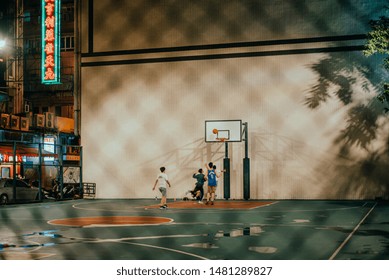 Hong Kong / China - 06 01 2019: People Play Basketball In Hong Kong, Public Sports Areas Recreational Area, Basketball Courts