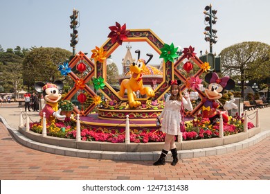 Hong Kong, China, 10 February 2018 : A Young Woman Posing In Hong Kong Disneyland View During Winter