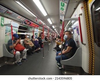 Hong Kong, China - April 06 2022: Insied The Train, The People Must Wear Mask Because Of COVID-19. Mong Kok MTR Station In Hong Kong. 