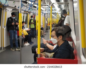 Hong Kong, China - April 08 2022: Insied The Train, The People Must Wear Mask Because Of COVID-19. Mong Kok MTR Station In Hong Kong.