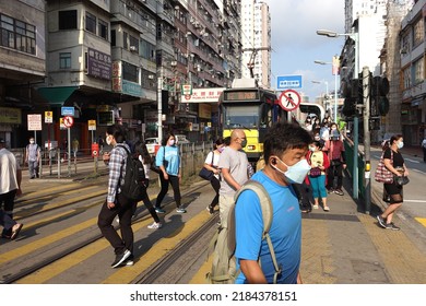 Hong Kong, China - April 27, 2022: City street view of Yuen Long and the People Wear Mask in Hong Kong.