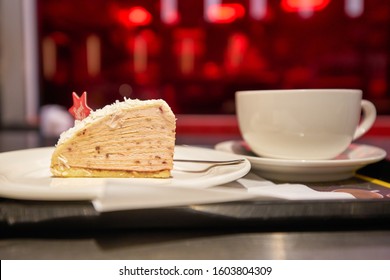 HONG KONG, CHINA - CIRCA DECEMBER, 2019: Close Up Shot Of Layer Cake And Cup Of Coffee Served On Tray At McCafe At A McDonald's Store Place In Hong Kong.