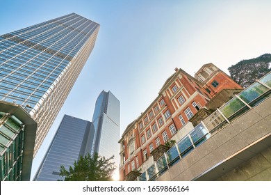 HONG KONG, CHINA - CIRCA JANUARY, 2019: Low Angle View Of Former French Mission Building And Skyscrapers In Hong Kong.