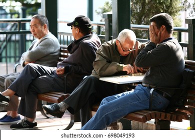 HONG KONG, CHINA - FEB 3 2009: Local Retired Elderlies Play Chinese Chess And Chat In Hoi Sham Park