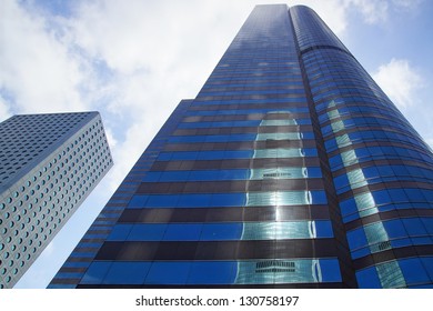 HONG KONG, CHINA - FEBRUARY 16: IFC is reflected in the Exchange Square Tower. This complex of office towers is home to the Hong Kong Stock Exchange on February 16, 2013 in Hong Kong, China.
