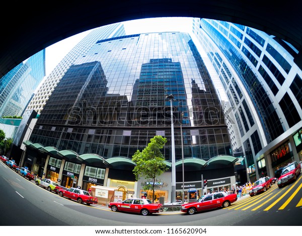 HONG KONG , CHINA - JULY 9, 2014 : Mongkok\
street,Taxi are a very popular choice in the city. The cost of\
private cars in the city is quite\
high.