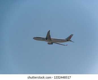 Hong Kong, China - MAR 2018: The Dragonair Airbus A330-343 Reg. B-HYJ are flying away from Hong Kong International Airport, Chek Lap Kok