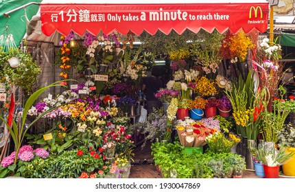 Hong Kong, China - May 12, 2010: Stanley Neighborhood. Flower Shop With Rich Colorful Variety Under Red Mcdonalds Awning.