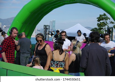 Hong Kong, China - November 27 2016: Audience Wearing Wireless Headphones Listening To DJ Live Set At Clockenflap Music And Art Festival Silent Disco Stage  